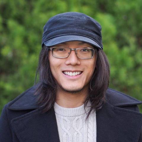 kevin yang smiling with a black hat on